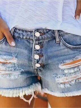 High-Rise Distressed Denim Shorts in Light Blue